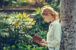 Young woman reading a book